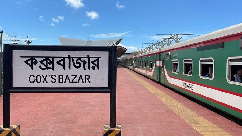 Sign indicating 'Cox's Bazar' next to the Probal Express train.